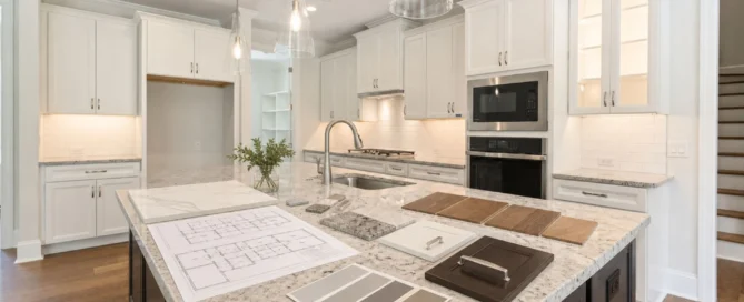Modern kitchen design with granite island featuring floor plans, cabinetry samples, and color swatches, ideal for home builder projects.